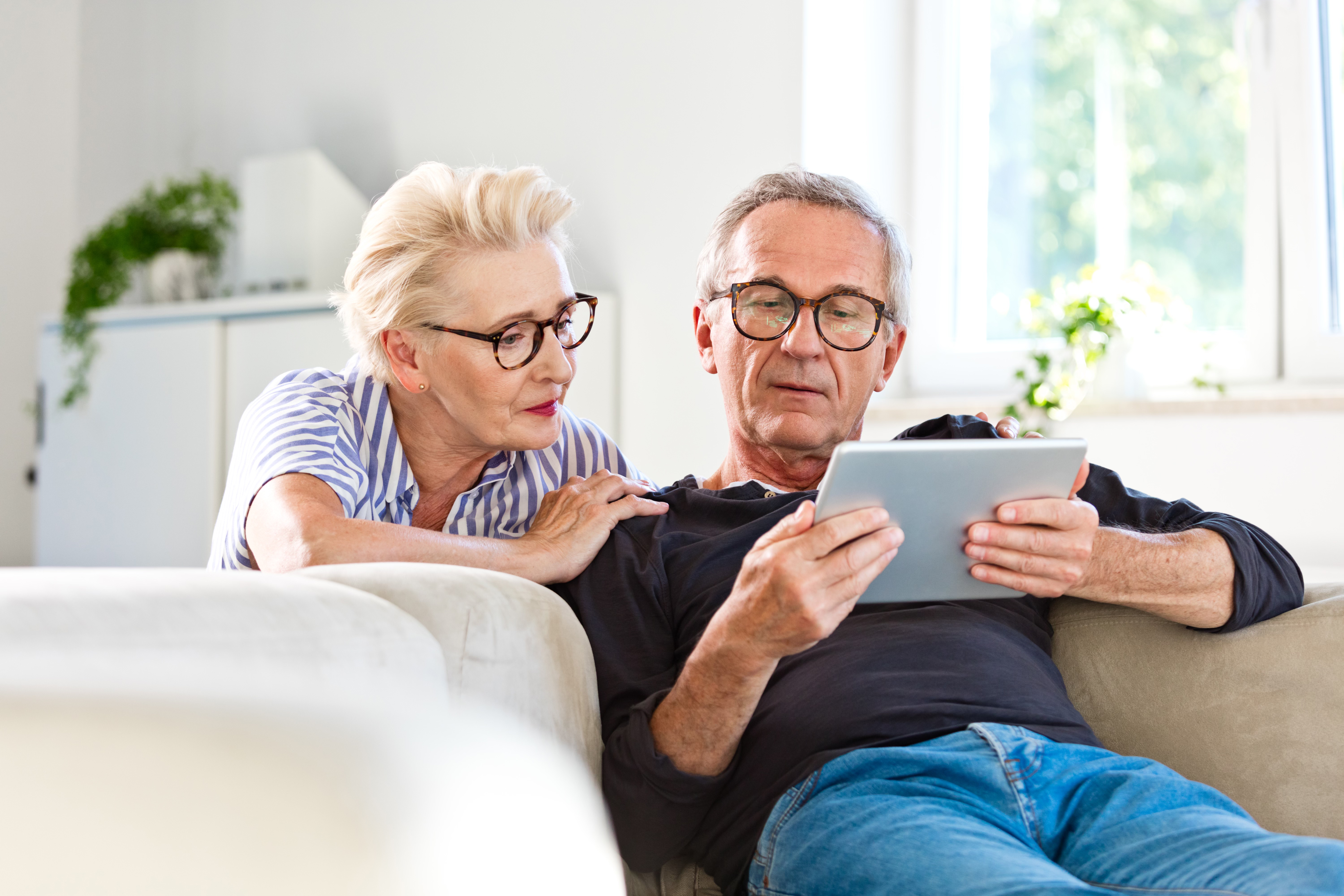 A couple looking at the tablet