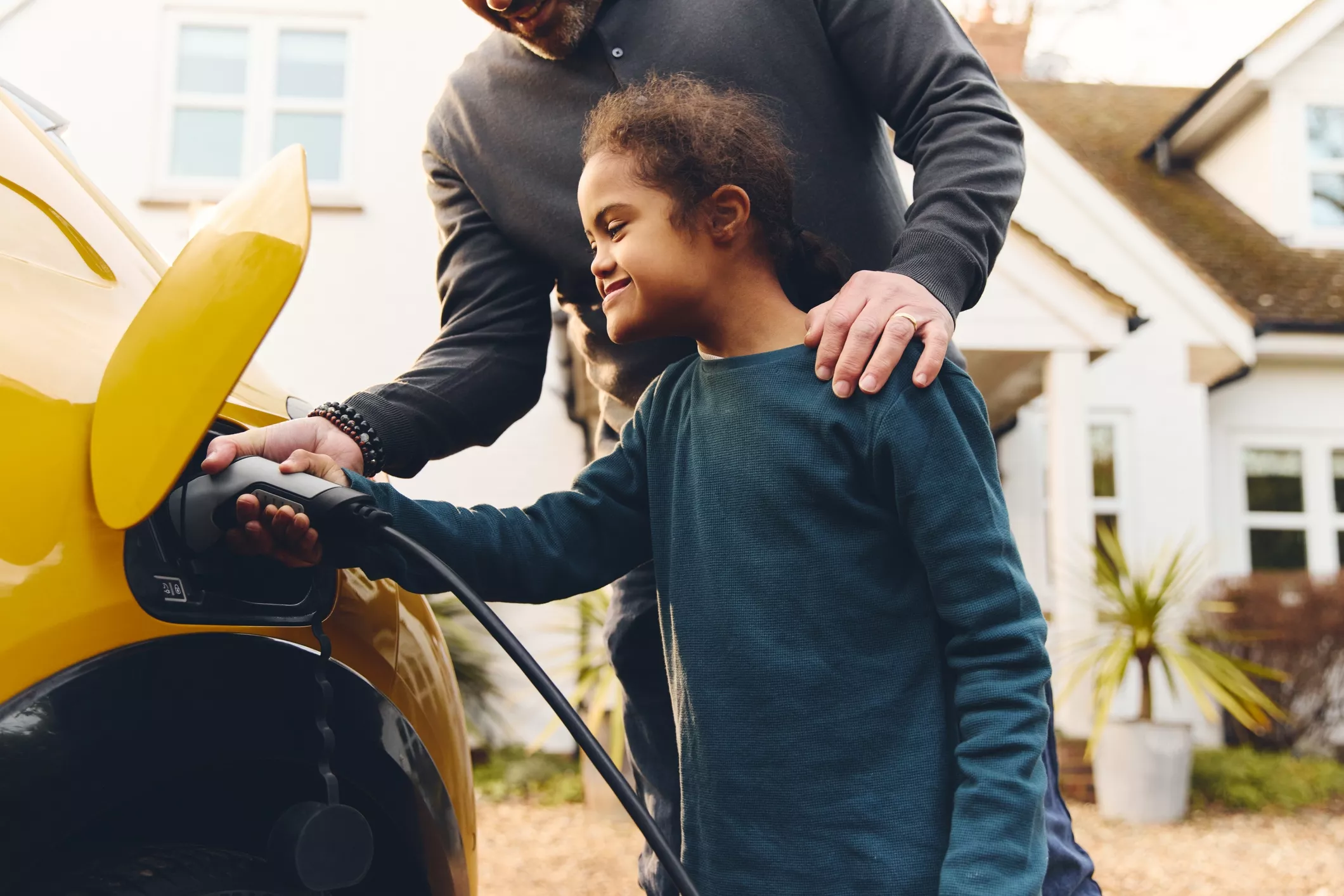 Young child charging EV