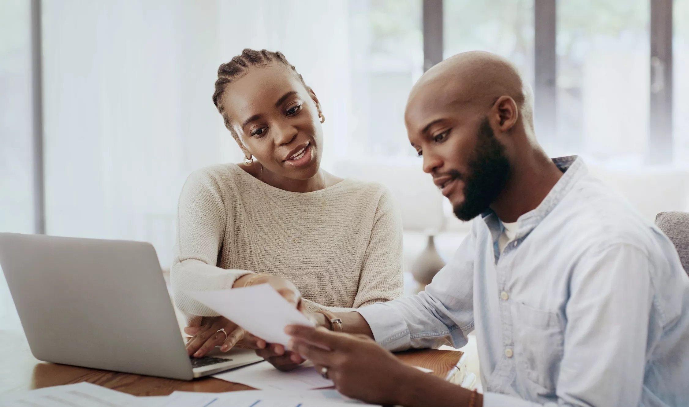 Couple using laptop