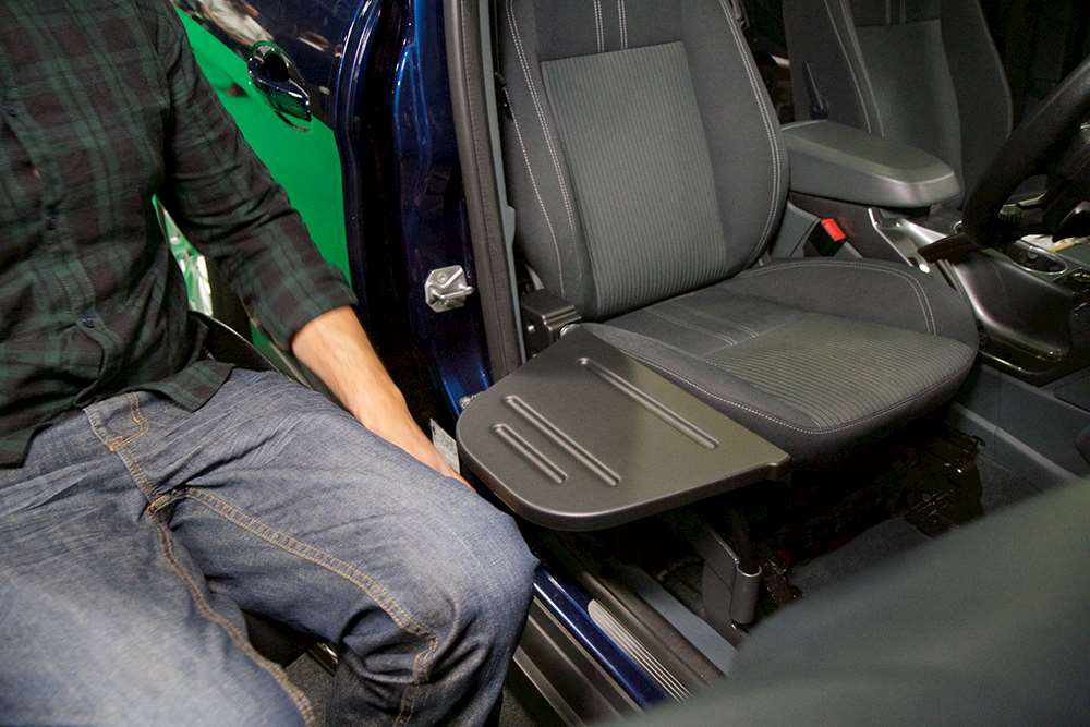 A transfer plate fitted to the side of a vehicle seat
