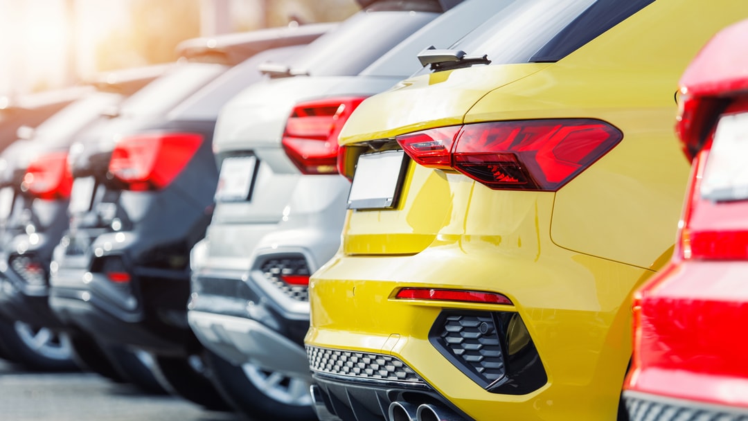 Several cars parked in a row
