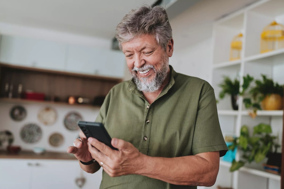 customer with a smart phone, smiling
