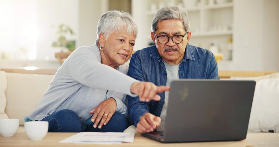 Couple using laptop