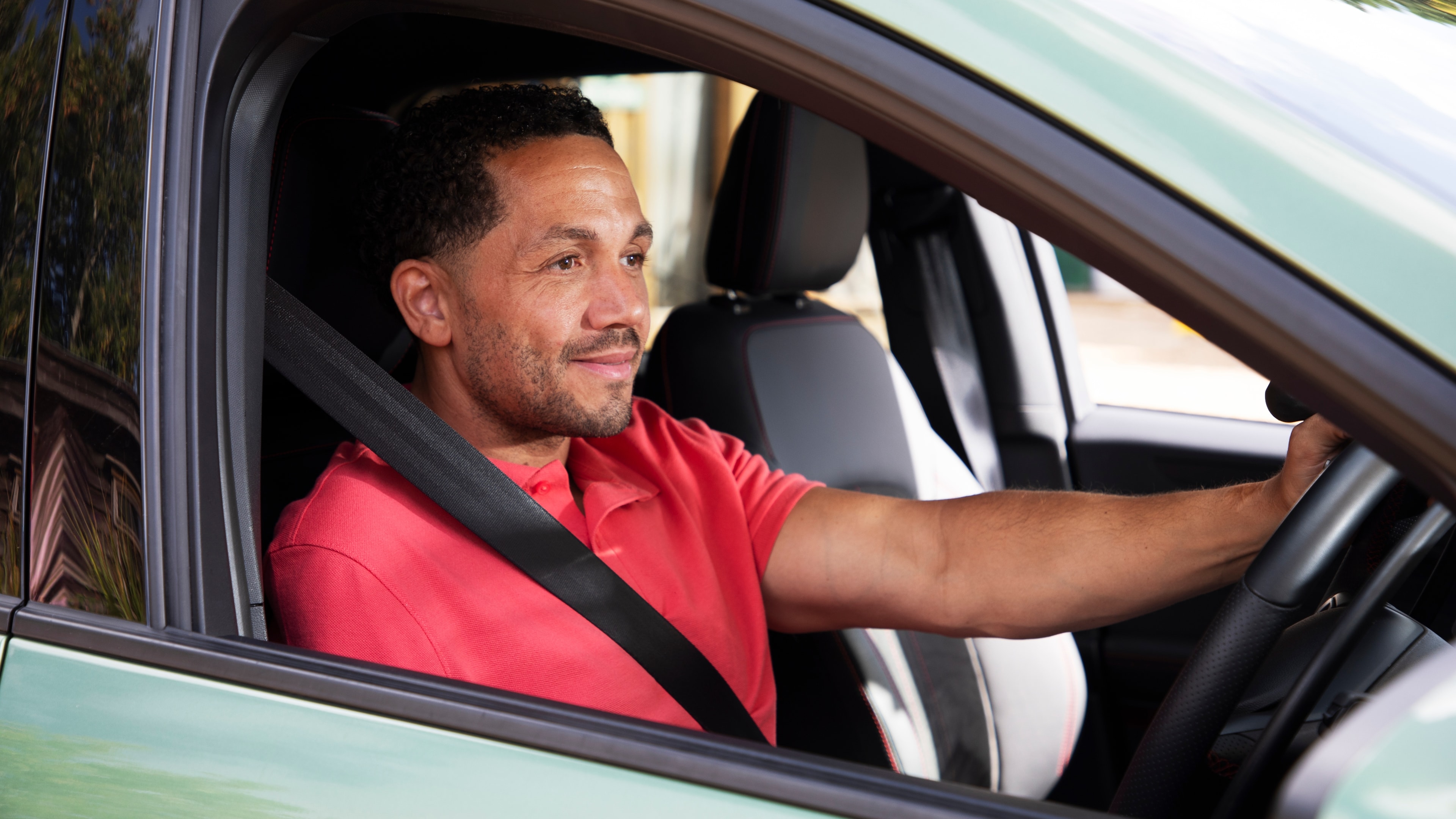 A man driving a car