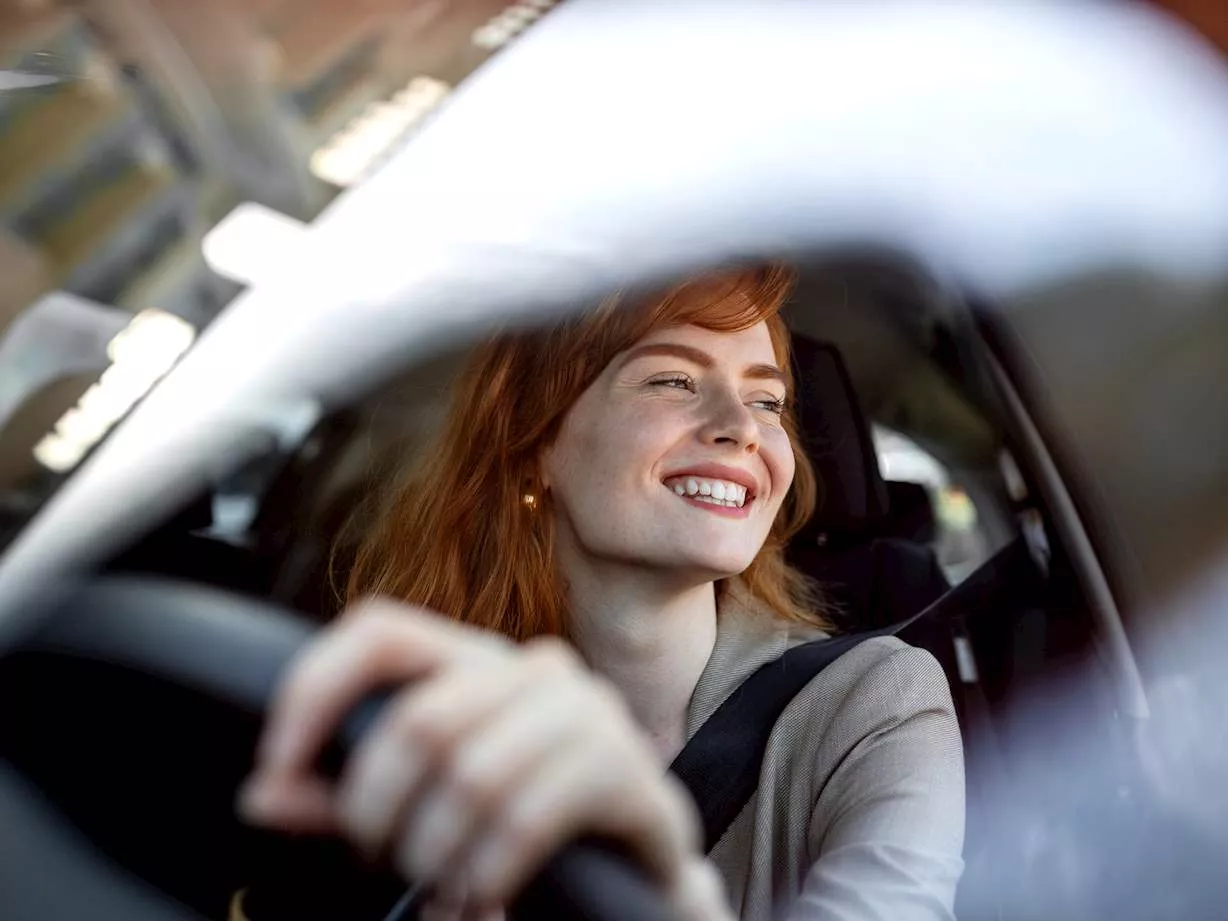 A person driving a car