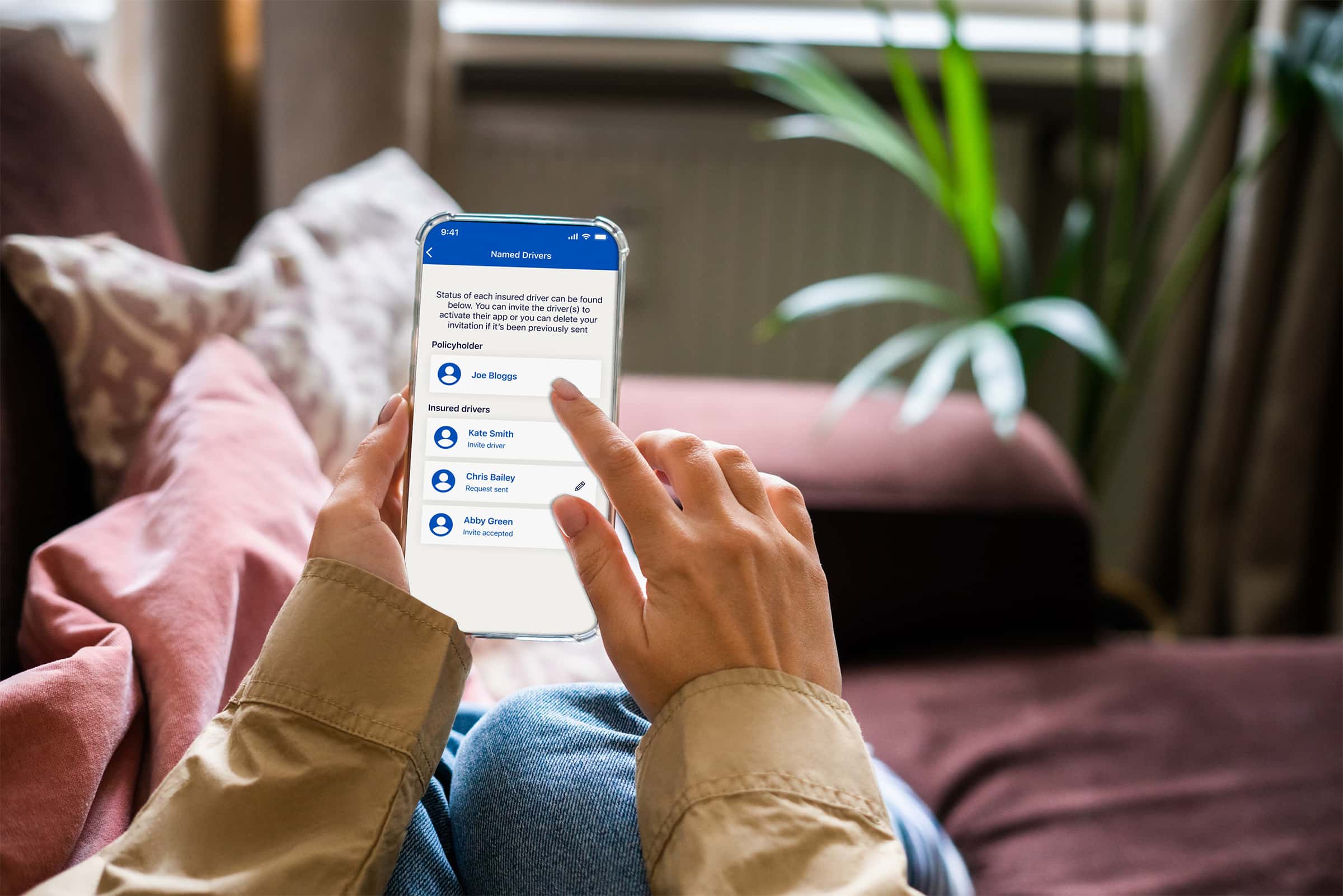 A person using their mobile phone to review their driver details