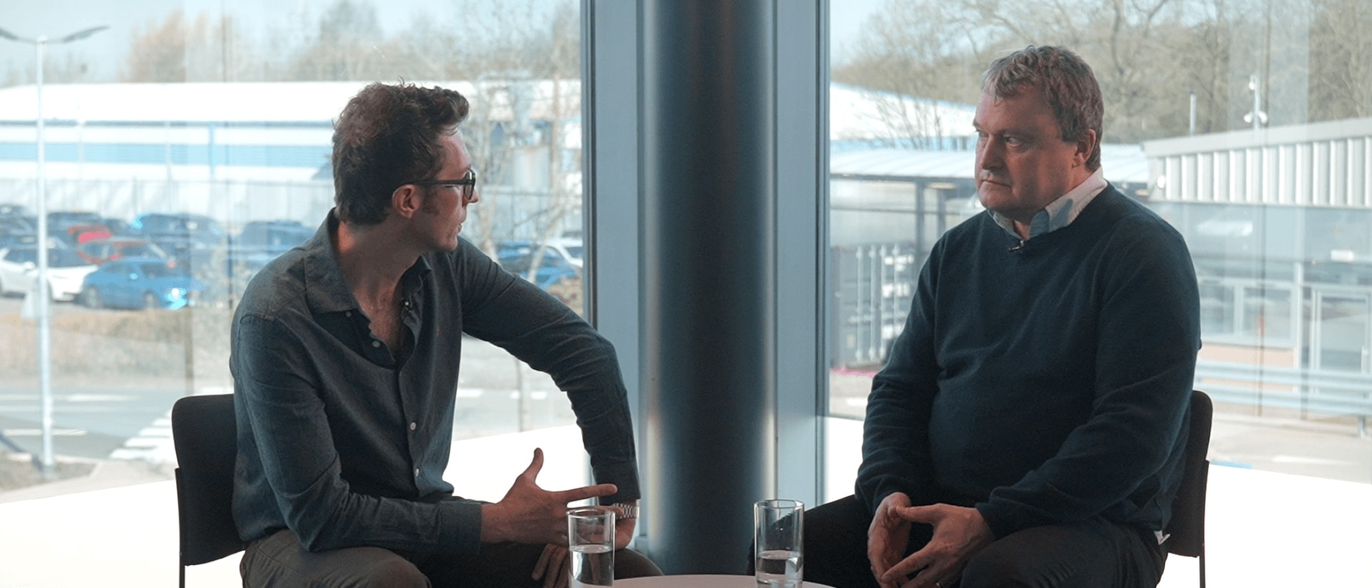 2 men sat down facing each other for a interview