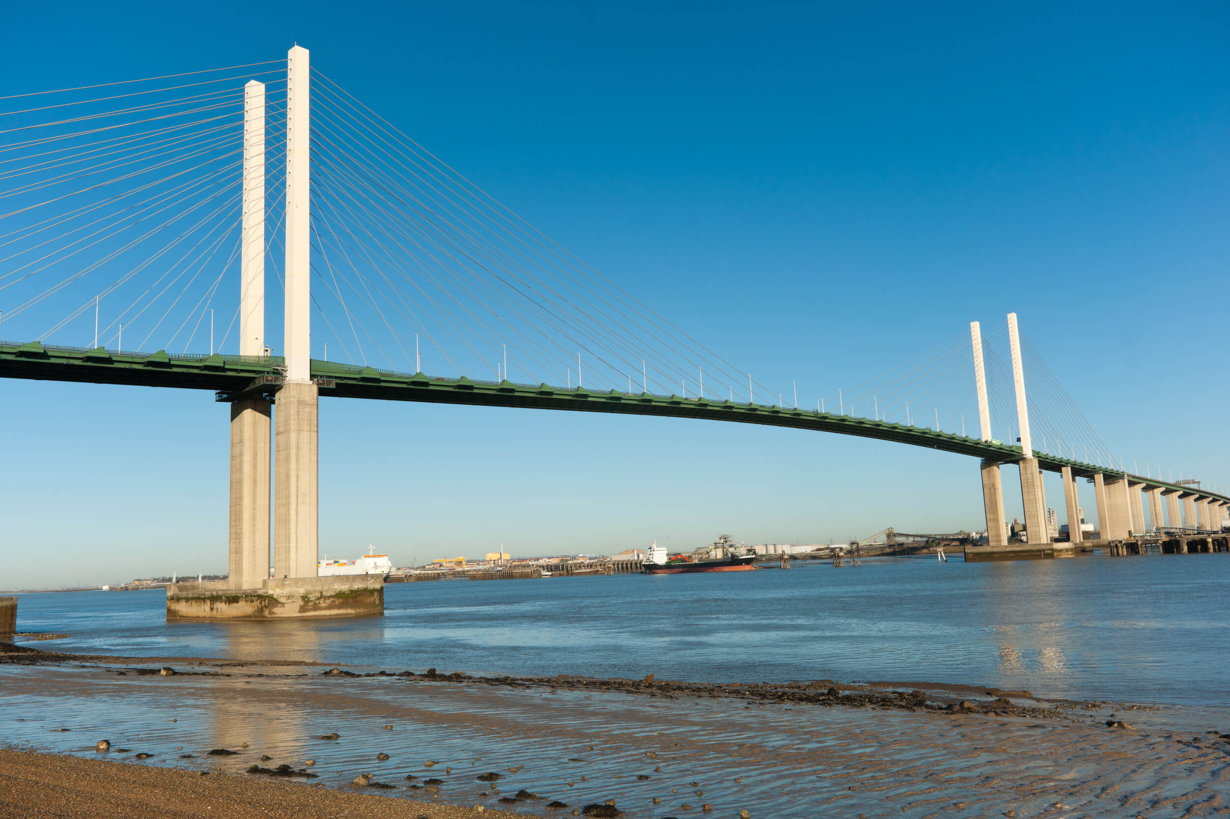 Queen Elisabeth II bridge over the river Thames, in West Thurrock, UK against a clear blue sky