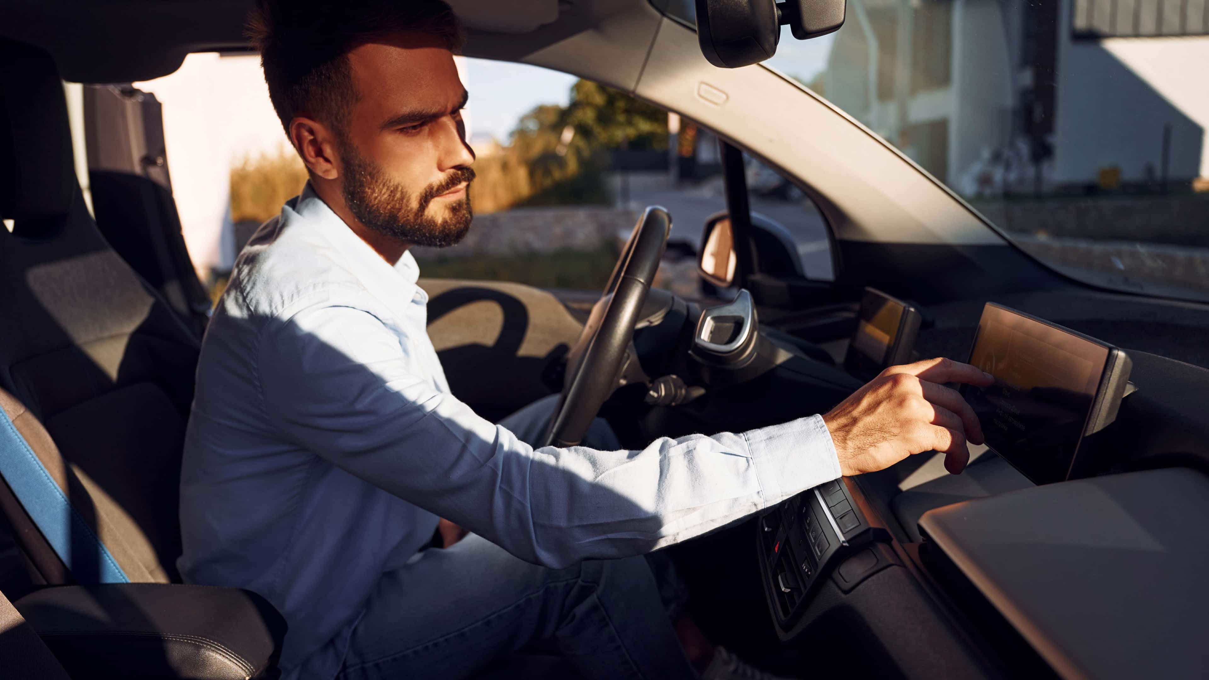 man-inside-the-electric-car-in-hot-weather